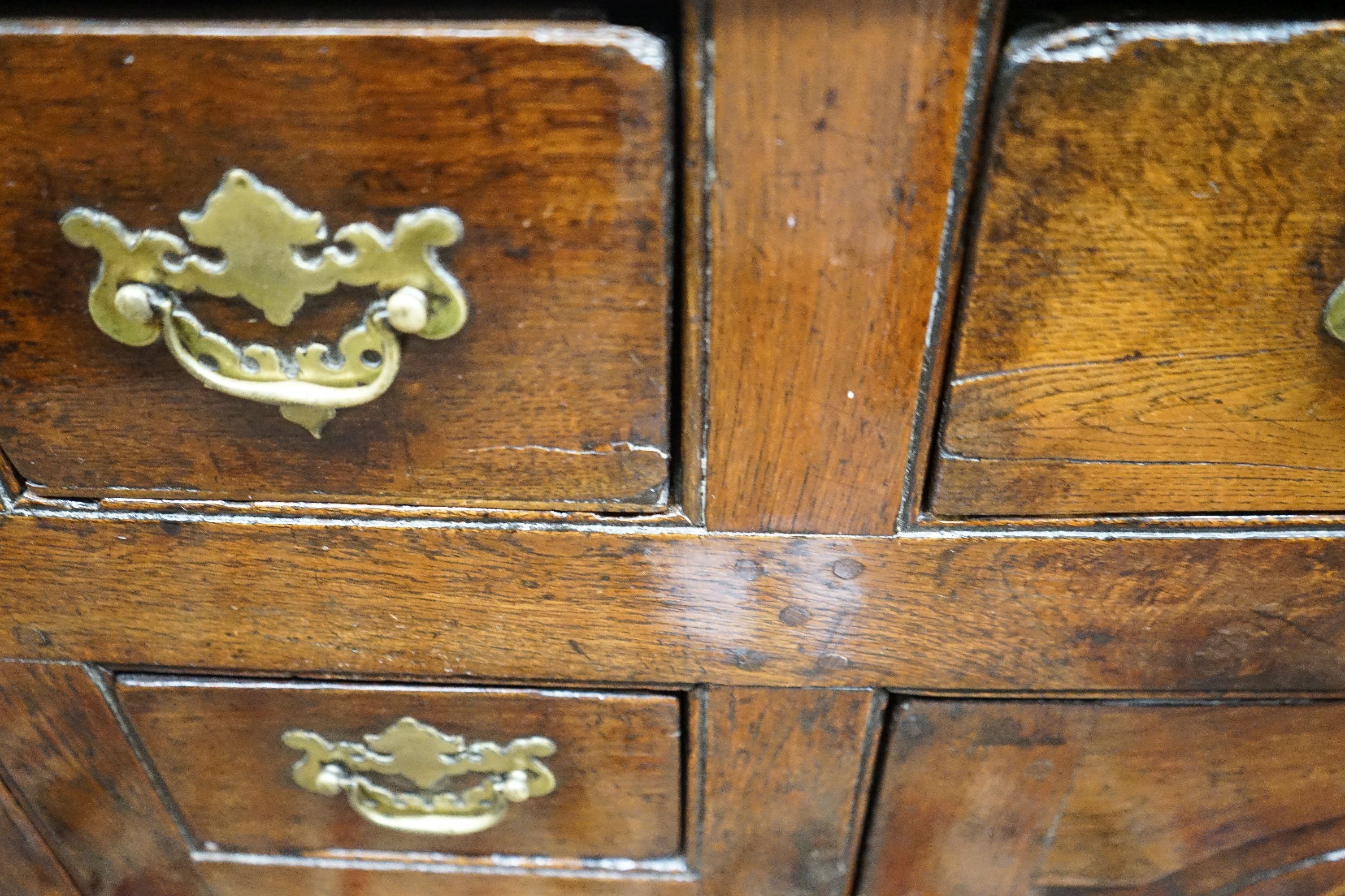 A mid 18th century oak dresser base, length 140cm, depth 55cm, height 88cm